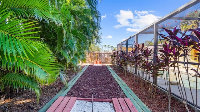 view of yard featuring a lanai