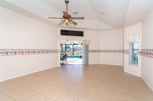 spare room featuring light tile patterned floors, ceiling fan, and lofted ceiling