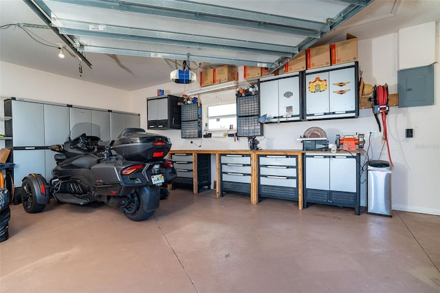 garage featuring electric panel and a garage door opener