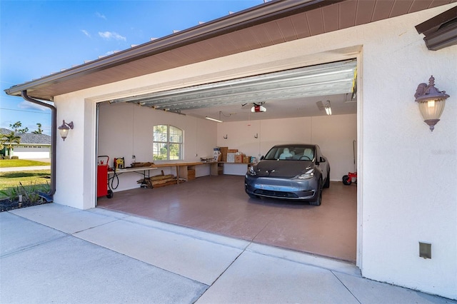 garage featuring a garage door opener