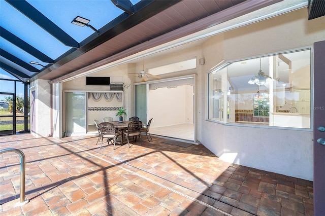 view of patio / terrace with a lanai and ceiling fan