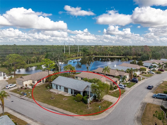 birds eye view of property featuring a water view