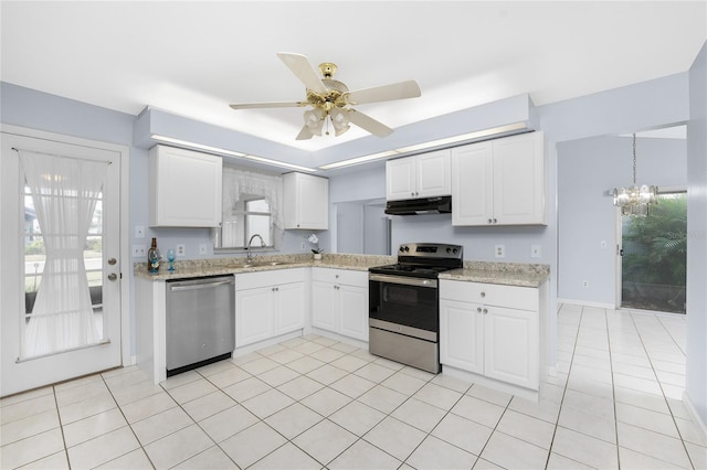 kitchen with plenty of natural light, white cabinets, stainless steel appliances, and sink