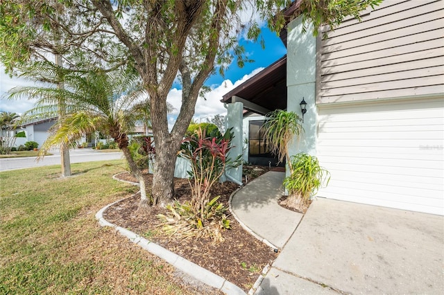 view of property exterior with a yard