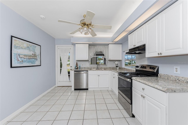 kitchen with stainless steel appliances, ceiling fan, sink, light tile patterned floors, and white cabinets