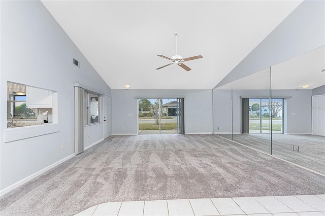 unfurnished living room featuring ceiling fan, sink, light carpet, and high vaulted ceiling