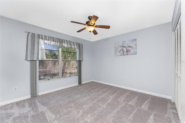 unfurnished bedroom with carpet flooring, ceiling fan, and a closet