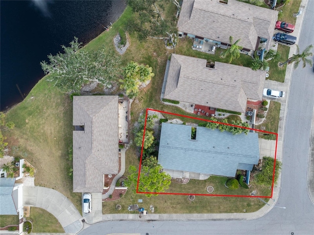 birds eye view of property featuring a water view