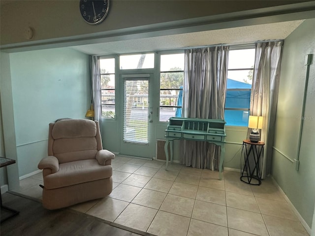 sitting room featuring light tile patterned floors