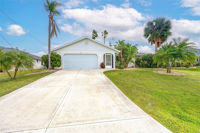 view of front of property with a garage and a front lawn