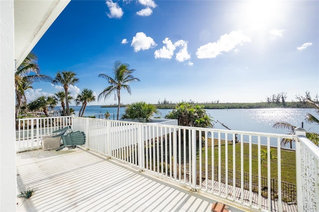 wooden deck featuring a water view