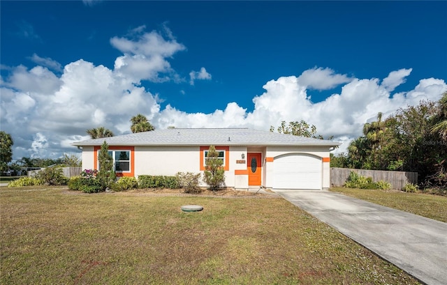 ranch-style house featuring a front lawn and a garage