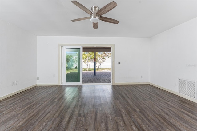 spare room featuring dark hardwood / wood-style floors and ceiling fan