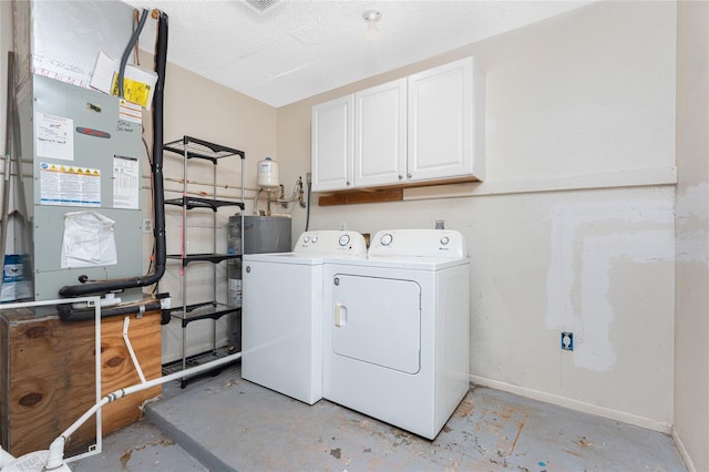 laundry room with cabinets and washer and dryer