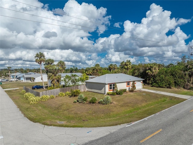 single story home with a front yard and a garage