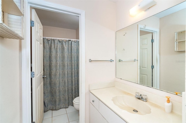 bathroom featuring tile patterned flooring, a shower with curtain, vanity, and toilet