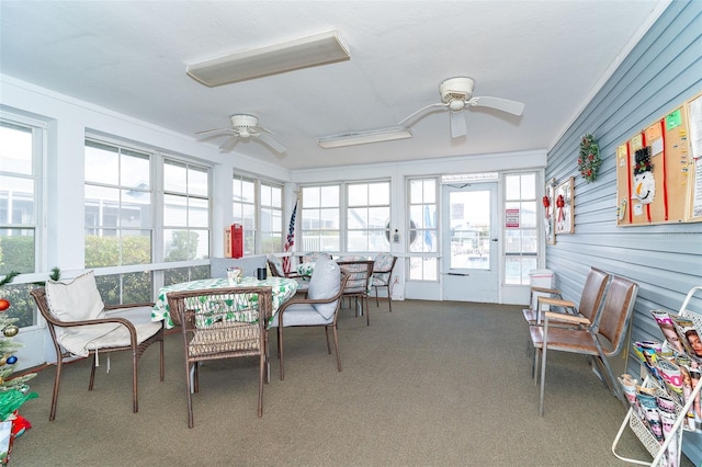 sunroom featuring ceiling fan and a wealth of natural light