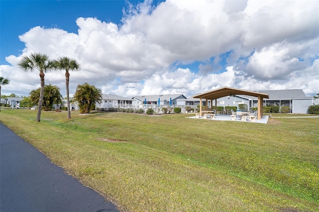 view of community featuring a yard