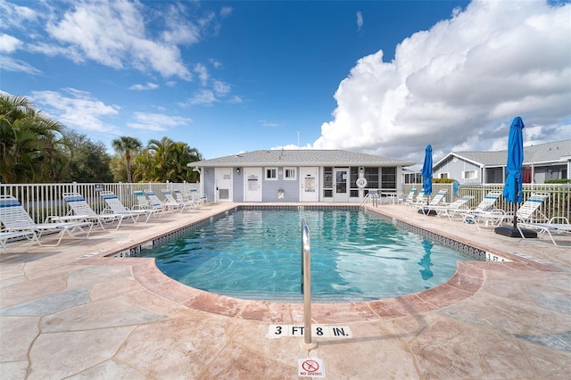 view of swimming pool with a patio area