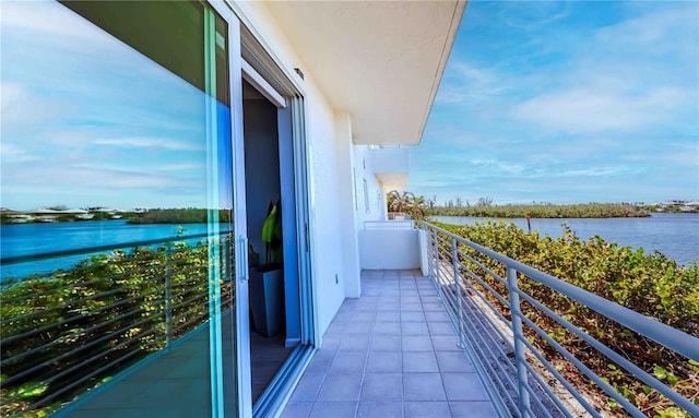 balcony featuring a water view