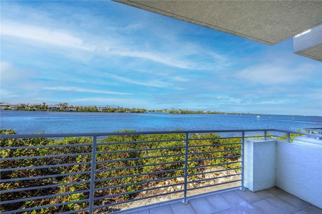 balcony featuring a water view