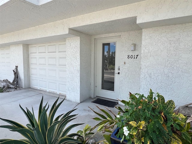 property entrance featuring a garage