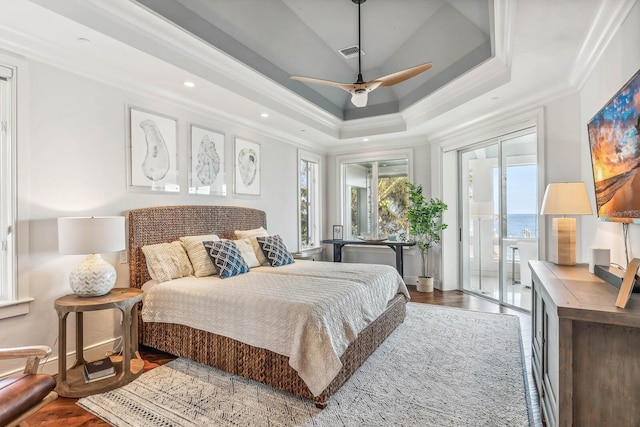 bedroom featuring hardwood / wood-style flooring, ceiling fan, access to exterior, and ornamental molding