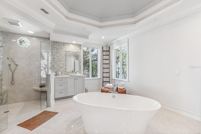 bathroom featuring ornamental molding, vanity, a tray ceiling, independent shower and bath, and tile patterned flooring