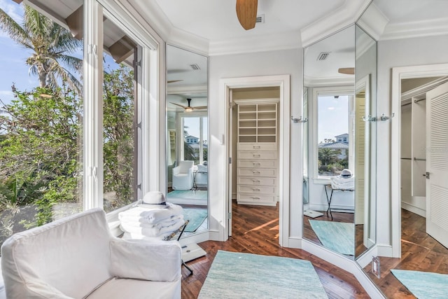 interior space with ceiling fan