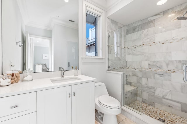 bathroom featuring vanity, crown molding, tile patterned flooring, toilet, and a shower with shower door