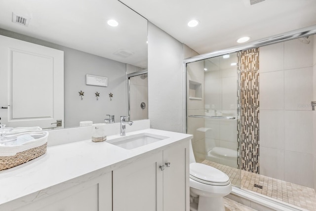 bathroom featuring hardwood / wood-style floors, vanity, toilet, and walk in shower