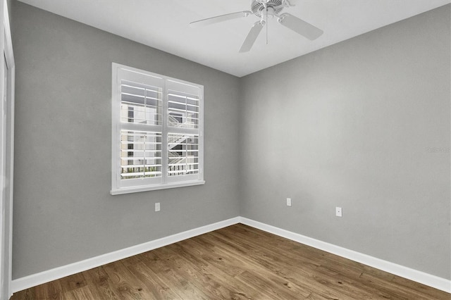 unfurnished room with ceiling fan and hardwood / wood-style floors