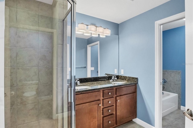 bathroom featuring vanity, tile patterned flooring, and independent shower and bath