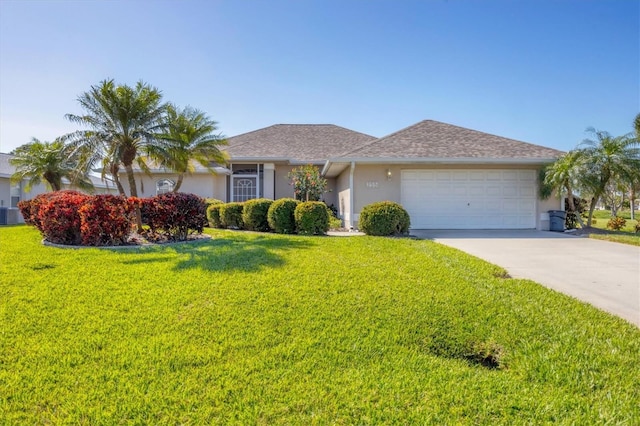 ranch-style house featuring a garage and a front lawn