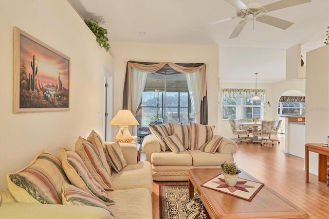 living room featuring hardwood / wood-style flooring, plenty of natural light, and ceiling fan