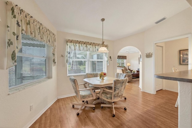 dining room featuring ceiling fan and light hardwood / wood-style flooring