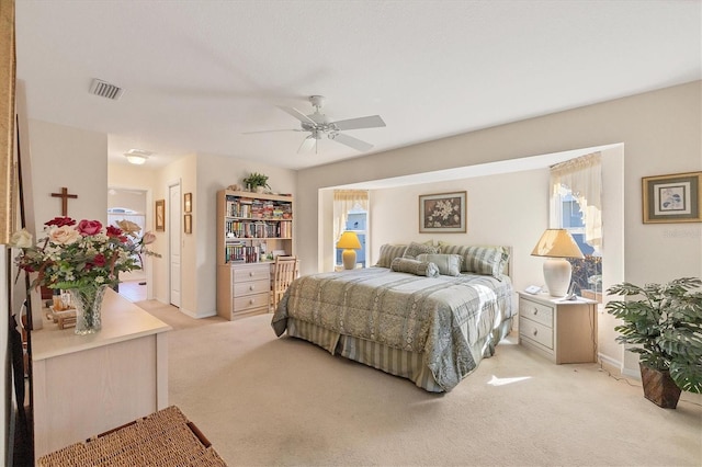 bedroom featuring ceiling fan and light colored carpet