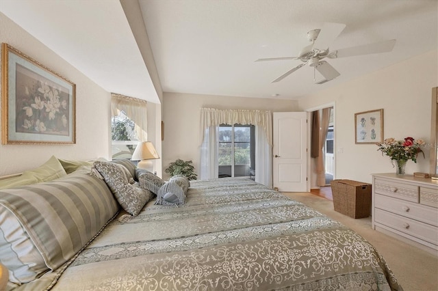 bedroom with ceiling fan and light carpet