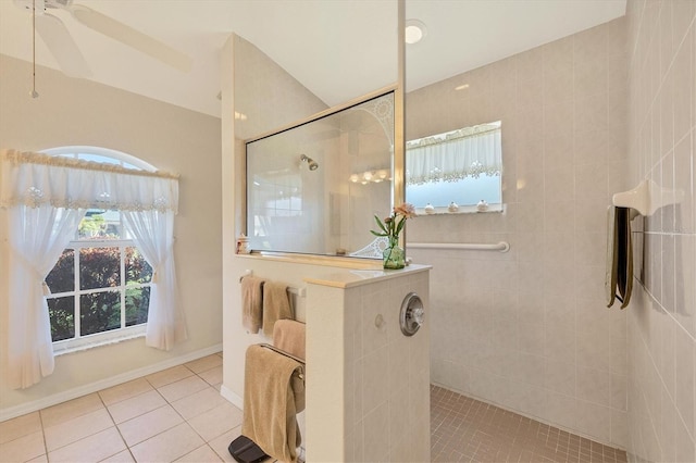 bathroom featuring tile patterned floors, ceiling fan, a healthy amount of sunlight, and tiled shower