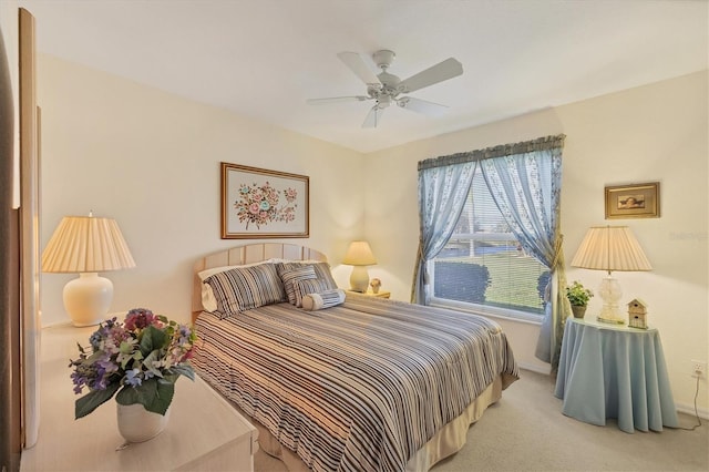 bedroom with light carpet and ceiling fan