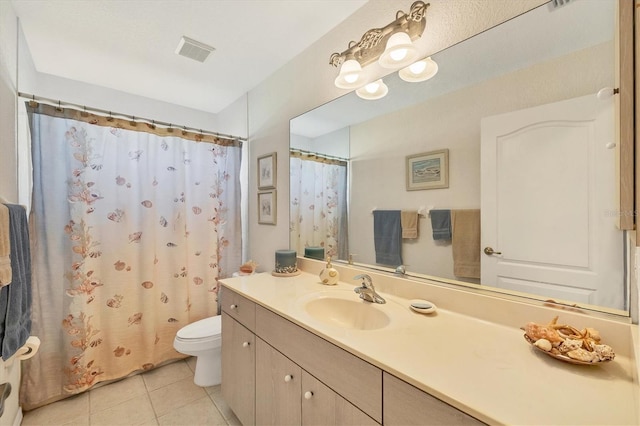 bathroom with walk in shower, tile patterned flooring, vanity, and toilet