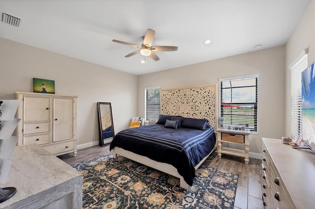 bedroom featuring ceiling fan and dark hardwood / wood-style floors