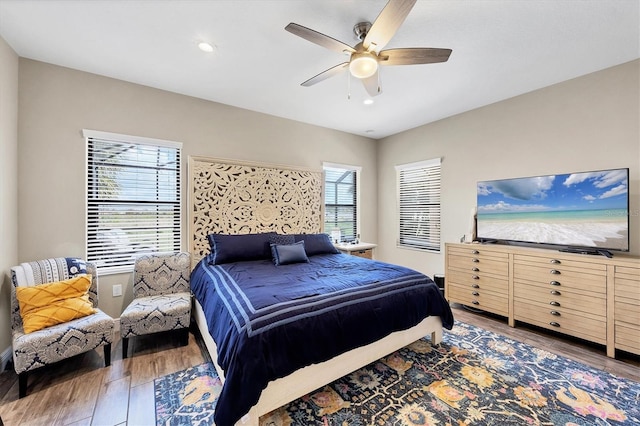 bedroom with ceiling fan and wood-type flooring