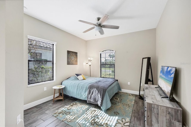 bedroom with ceiling fan and wood-type flooring