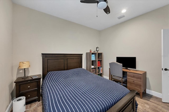 bedroom with ceiling fan and light wood-type flooring