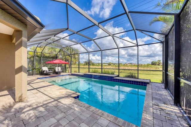 view of pool featuring a lanai and a patio