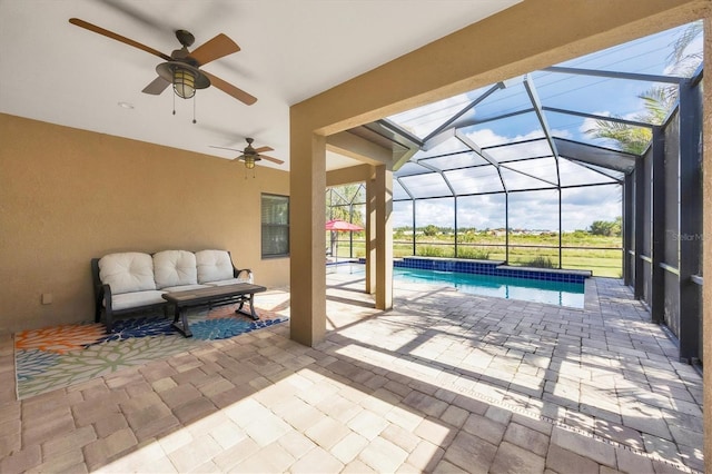 view of swimming pool featuring a lanai, an outdoor living space, and a patio