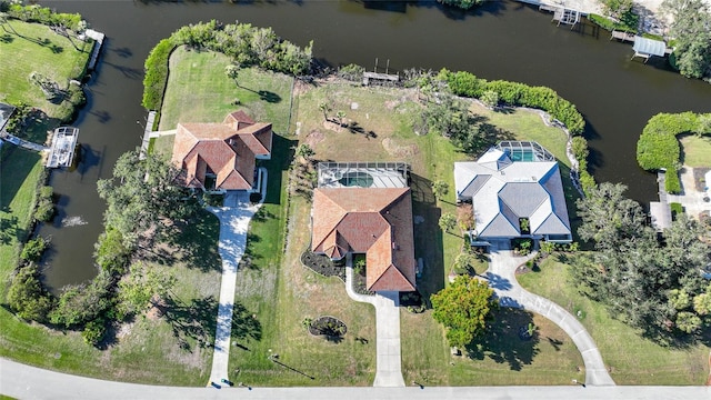 birds eye view of property with a water view