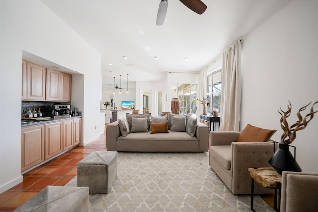 tiled living room featuring ceiling fan