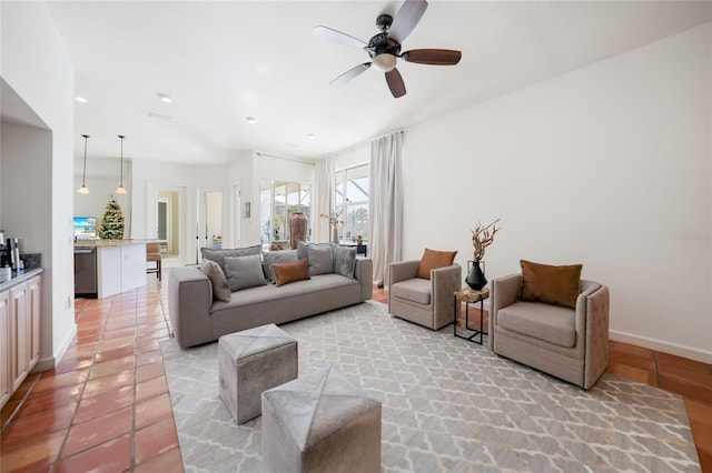 living room featuring ceiling fan and light tile patterned floors